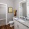 Bathroom with granite countertops and attached closet
