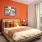 Master bedroom with orange decor