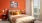 Master bedroom with orange decor