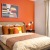 Master bedroom with orange decor