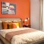 Master bedroom with orange decor