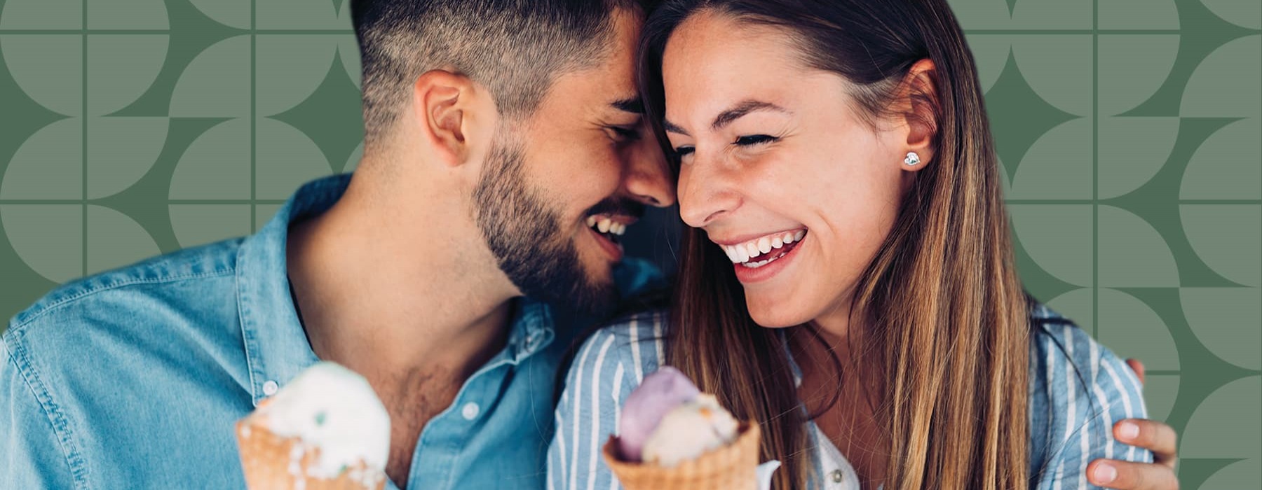 lifestyle image of a couple laughing while holding ice cream cones